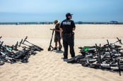 Scooters strewn about beach