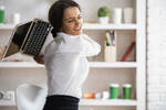 woman hurls laptop across office