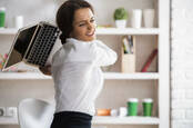 woman hurls laptop across office