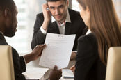 A man looks nervous at an interview