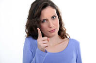 Woman wags finger at someone