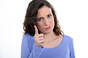 Woman wags finger at someone