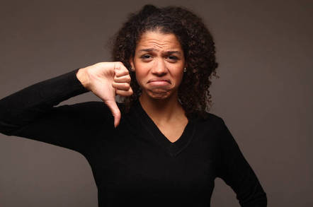 woman gives thumbs down signal