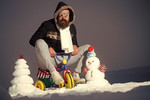 full-bearded hipster celebrates ironic christmas on trike