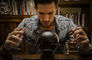 man gazes into crystal ball