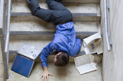 man falls down stairs, smashes laptop