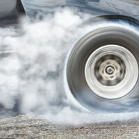 car speeds away - smoking wheels