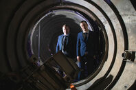 Skyrora CEO Vladimir Levykin and business development manager Daniel Smith  inside the remains of the Black Arrow projectile (the UK's only rocket to successfully launch a satellite into orbit) in a storage facility in Penicuik, near Edinburgh 