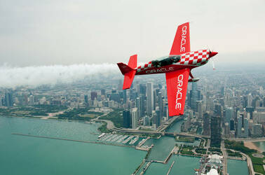 Team Oracle 8 ailerons custom built plane  flies in front of the Chicago skyline