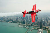 Team Oracle 8 ailerons custom built plane flies in front of the Chicago skyline