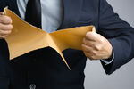 tearing up envelope/letter