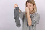 Someone holding a filthy sock
