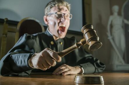 Angry judge slamming gavel