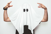 Man wearing ghost costume