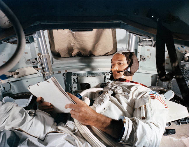 Command Module pilot Michael Collins practices in the CM simulator on June 19, 1969, at Kennedy Space Center.
