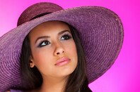 Woman wearing purple hat