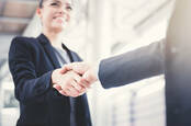 Businesspeople shaking hands on a deal