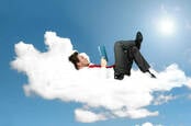 man relaxes on cloud