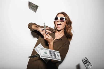 A woman throwing money in the air