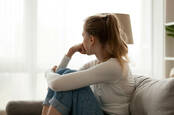 A woman looking out of a window