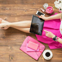 Someone using an iPhone and iPad at the same time