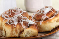 three cinnamon danishes on a plate