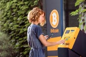 Someone using a Bitcoin ATM