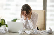 A frustrated woman at a computer