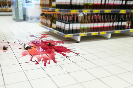 Smashed bottle of wine in supermarket