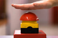 Hand above a red emergency button