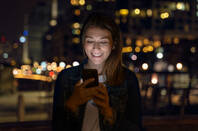 Someone using their phone at night