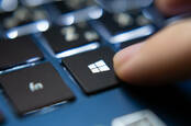 A close-up of the Windows key on a PC keyboard