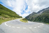 Mountain road with 180 degree turn on Fluela pass connecting cities of Zernez and Davos in Switzerland