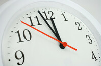 Clock face showing the hands at two minutes to midnight