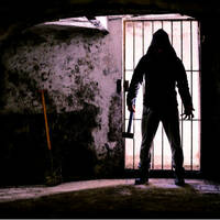 Man holding hammer inside dungeon