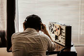 An officer listening to a wiretap