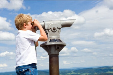 Boy using viewpoint binoculars