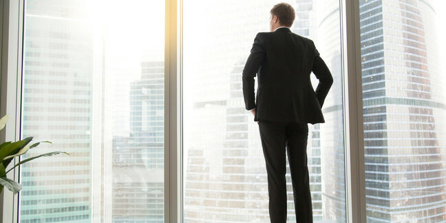 Businessman looking out window