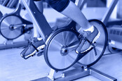 Exercise bike with spinning wheels