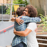 Two friends hug it out