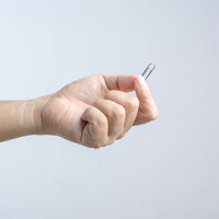 Hand holding paper clip