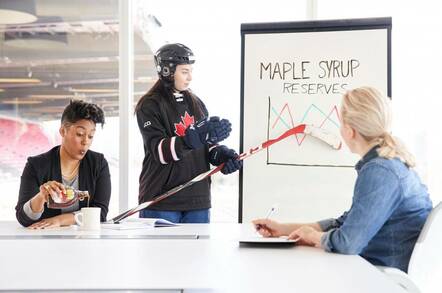 Three Canadians in an office discussing maple syrup reserves