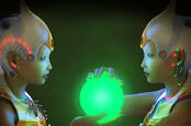 cassandra and her twin android - looking into a glowing glass orb 