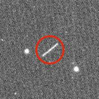 The circled streak in the center of this image is asteroid 2020 QG, which came closer to Earth than any other nonimpacting asteroid on record. It was detected by the Zwicky Transient Facility on Sunday, Aug. 16 at 12:08 a.m. EDT (Saturday, Aug. 15 at 9:08 p.m. PDT). Credits: ZTF/Caltech Optical Observatories