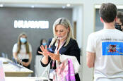 Visitors check out a smartphone display at IFA 2020. © Messe Berlin GmbH