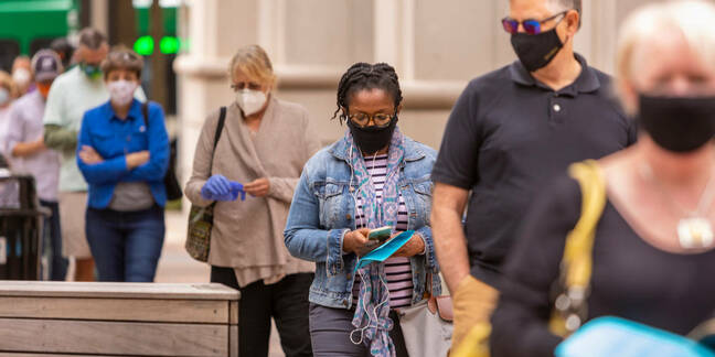 ARLINGTON, VIRGINIA, USA - SEPTEMBER 18, 2020: People line up during first day of early voting, 2020 presidential election.