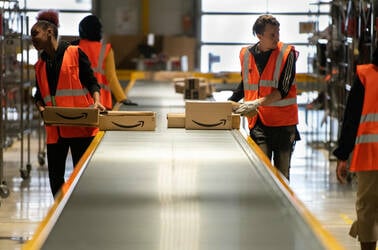 Amazon workers in  Vélizy-Villacoublay in France sorting packages in late 2019