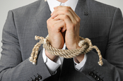 Businessman with hands tied