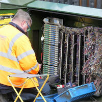 Chorleywood, Hertfordshire, England, UK - March 7th 2020: BT Openreach engineer working at cabinet box. Openreach is a functional division of the telecommunications company BT plc.