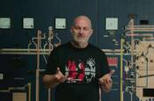 Dr Werner Vogels expounding the benefits of observability at an ancient food processing factory.